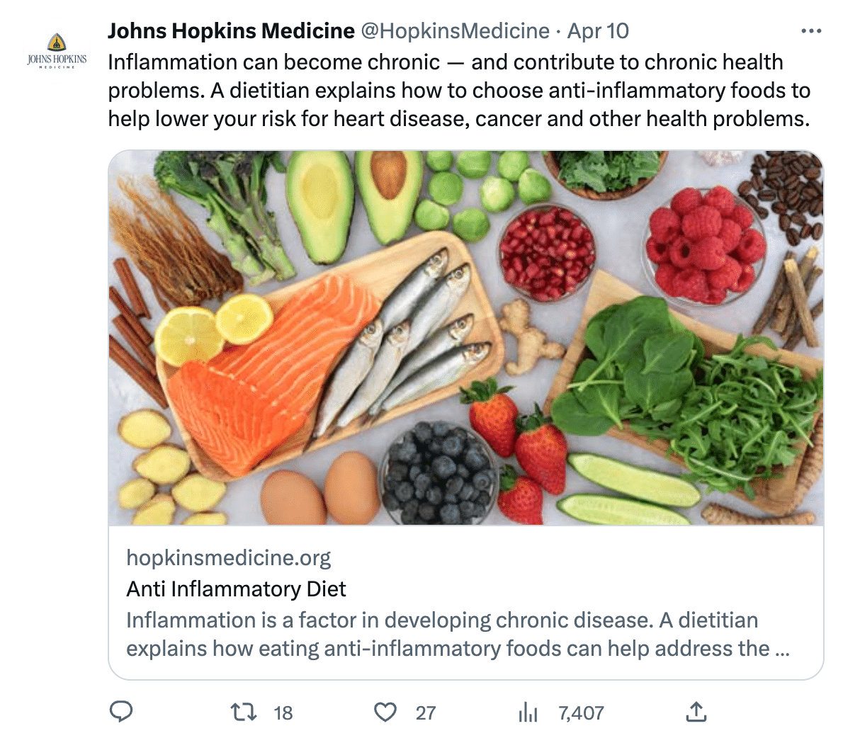 A tweet from Johns Hopkins Medicine about anti inflammatory eating uses a stock photo of fish, fruits and vegetables. 