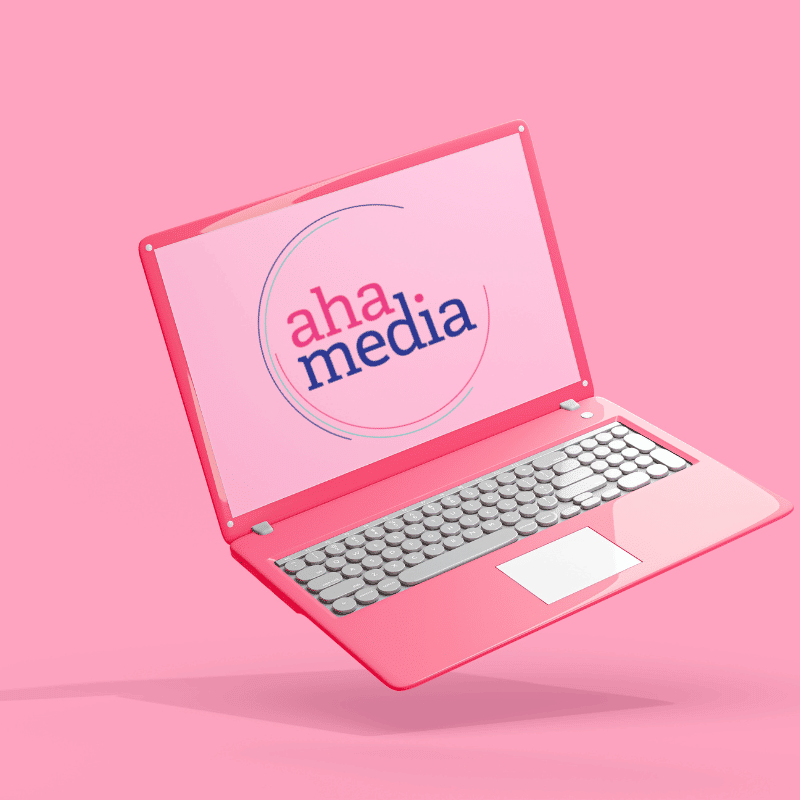 Pink Laptop with Aha Media logo