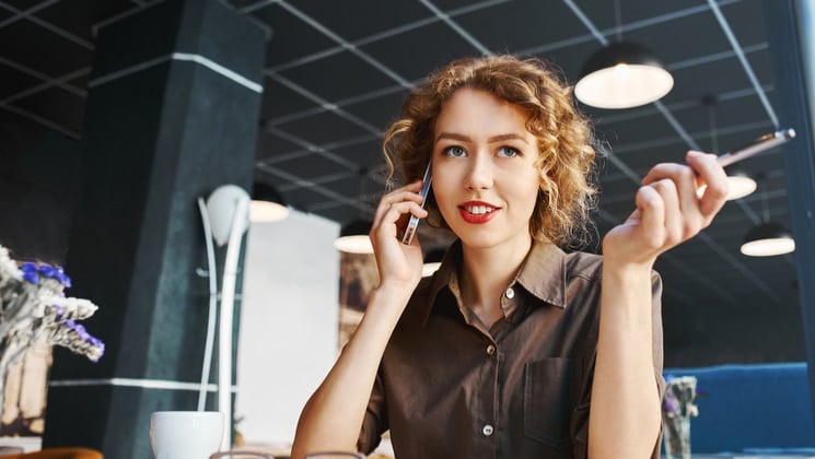 smiling woman talking on cell phone