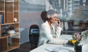 Business woman talking on the phone in her office