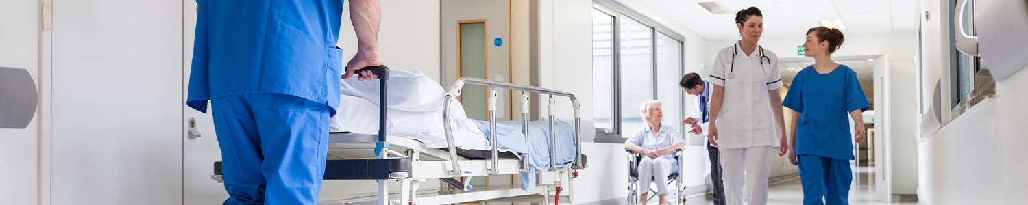 doctor and nurse walking down hospital hallway