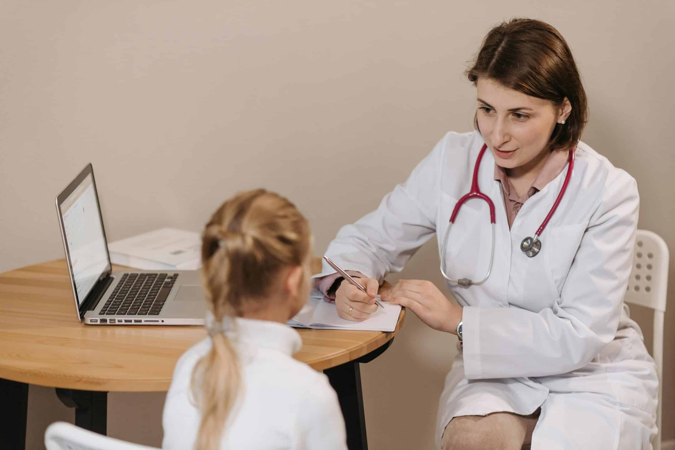 doctor speaks with child patient