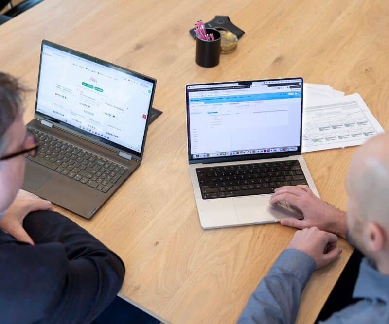 Aha Media team at computer